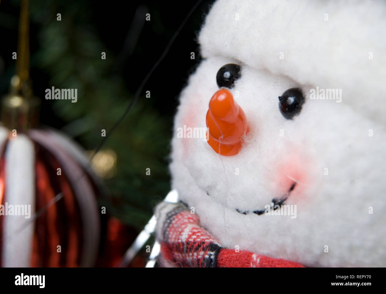 Snowman Christmas ornament hanging on tree, USA. Stock Photo