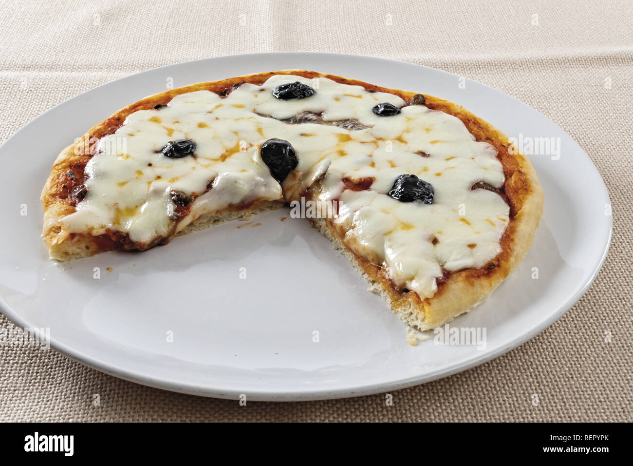 pizza tomato black olives anchovies cut cheese Stock Photo Alamy