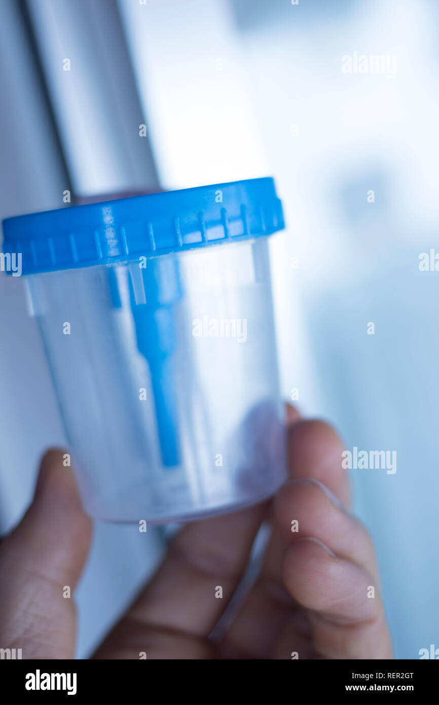Medical urine test cup to hold patient dope testing anti drugs, sample Stock Photo Alamy
