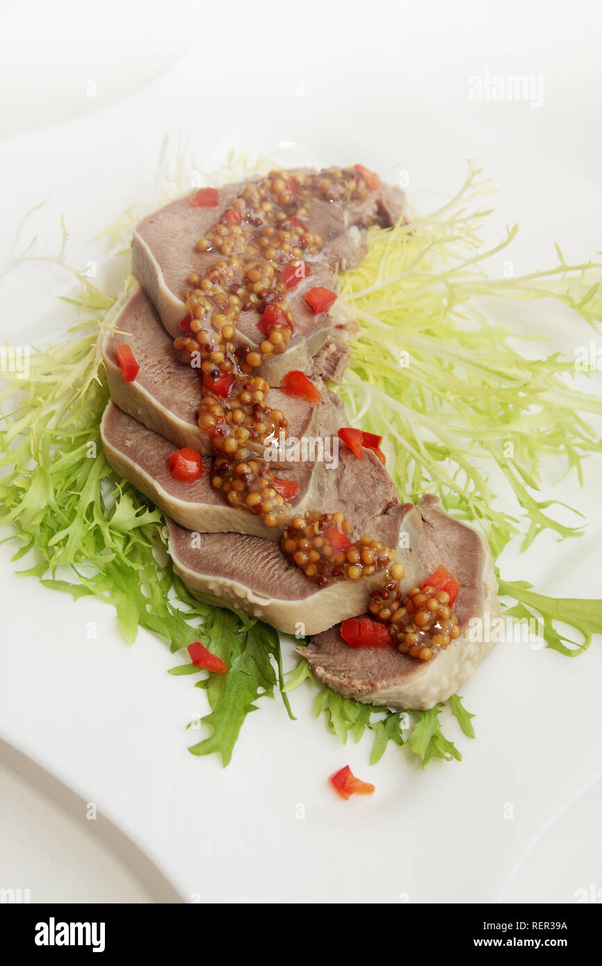 boiled pork tongue with French mustard and pepper Stock Photo Alamy