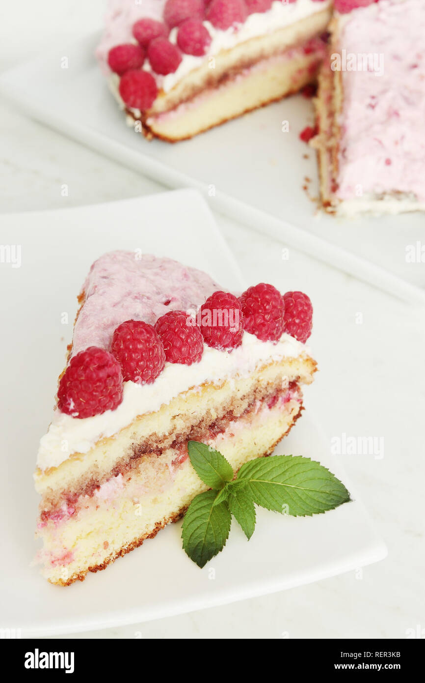 sponge cake with sour cream and raspberry Stock Photo Alamy