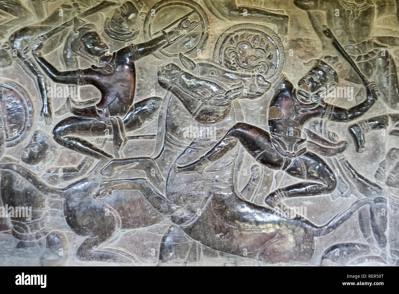 Warriors on horseback in the bas-relief frieze depicting Krishna's Victory over Bana on the north gallery wall, Angkor Wat, Siem Reap, Cambodia Stock Photo
