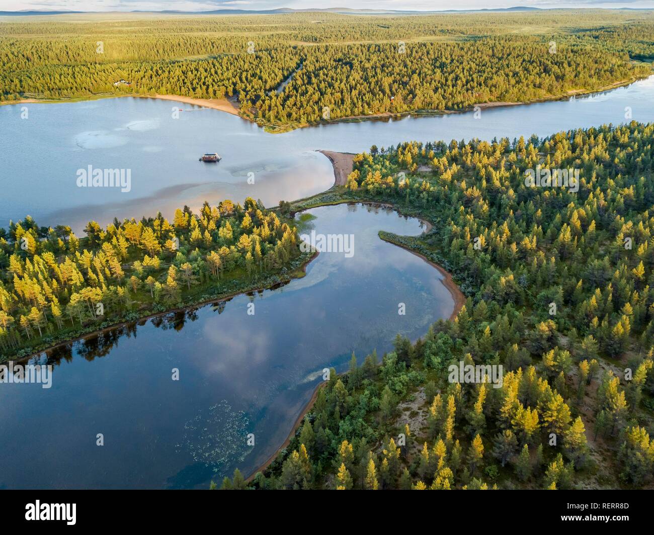 Drone view, aerial photo of floating house in Vuontisjärvi, lake in boreal arctic forest with conifers Stock Photo