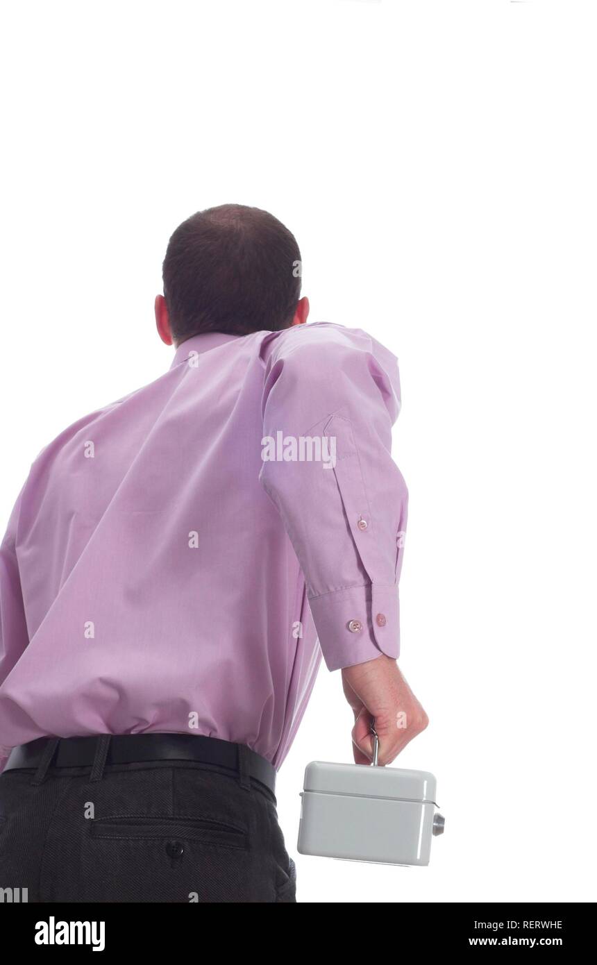Young business man running away from camera holding a locked cash box Stock Photo