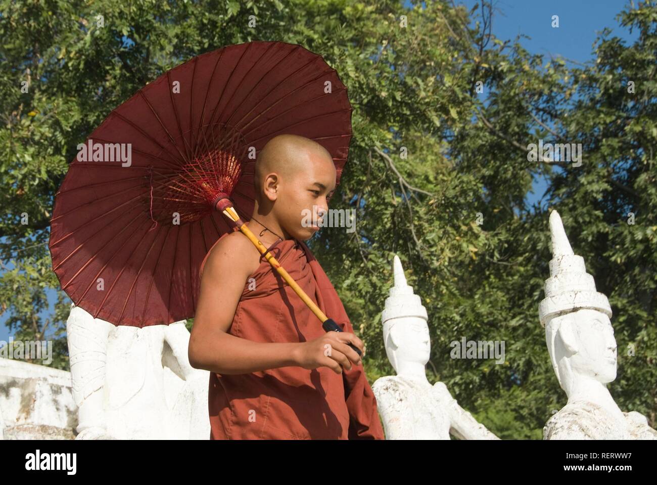 Buddhist monk with parasol hires stock photography and images Alamy