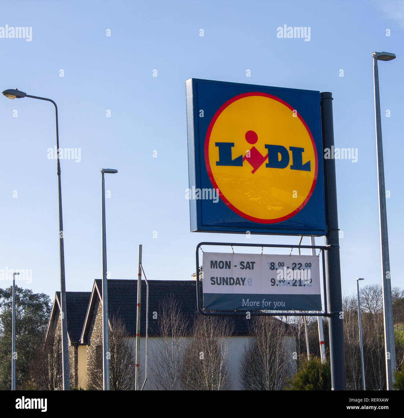 lidl supermarket sign with opening hours Stock Photo
