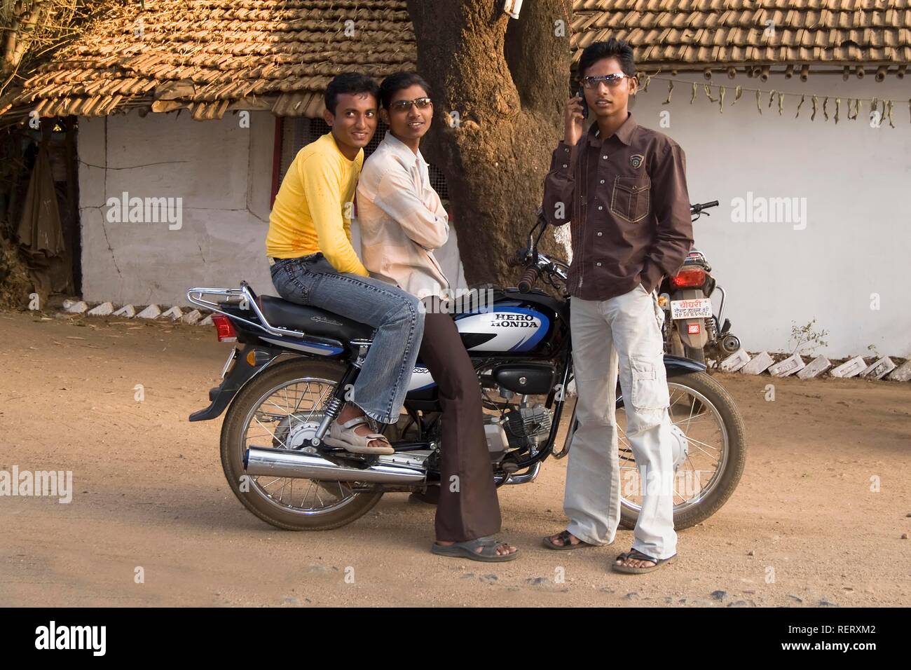 Street scene, young men on a motorcycle, Madhya Pradesh, India, South Asia Stock Photo