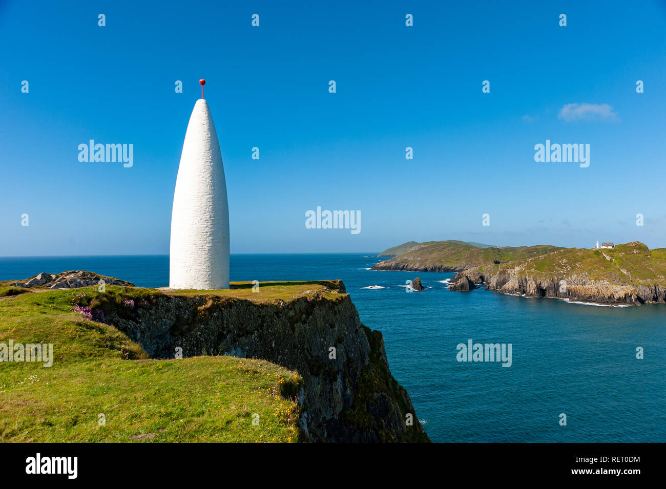 The Baltimore Beacon on the coast of County Cork, Ireland Stock Photo