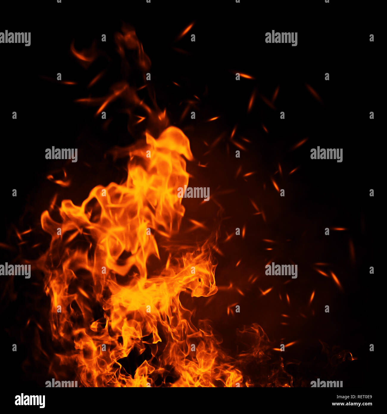 Texture of burn fire with particles embers. Flames on isolated black background. Stock Photo