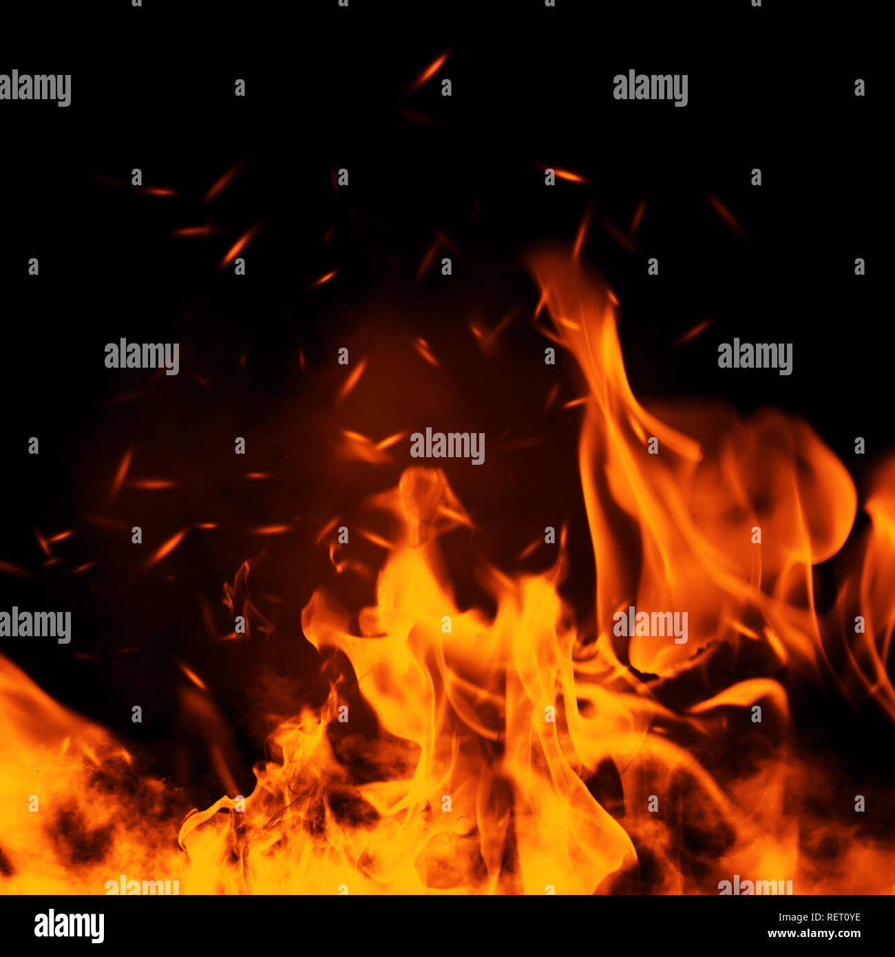 Texture of burn fire with particles embers. Flames on isolated black background. Stock Photo