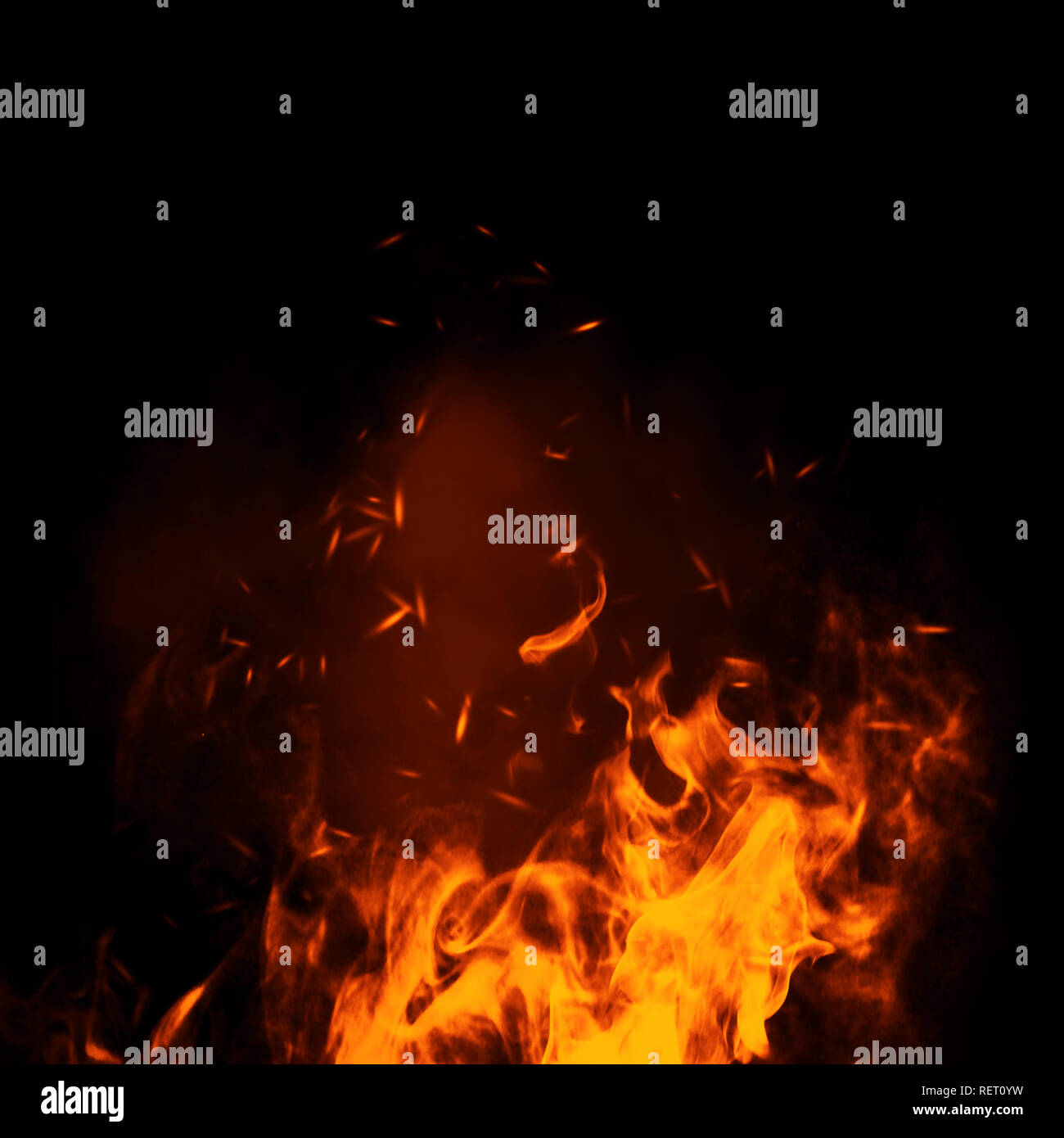 Texture of burn fire with particles embers. Flames on isolated black background. Stock Photo