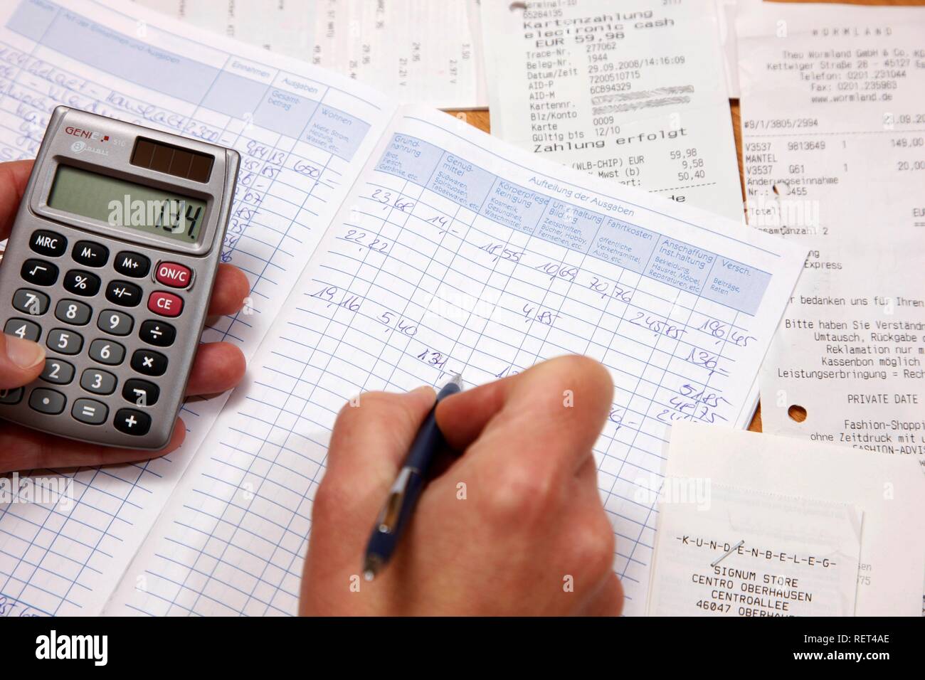 Private housekeeping book, calculator to control the expences Stock Photo