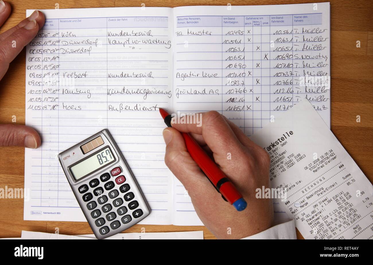 Writing a driver's logbook Stock Photo - Alamy