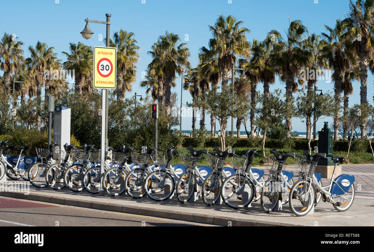 A row of Valenbisi rental bikes at a docking station in Valencia, Spain, Europe Stock Photo