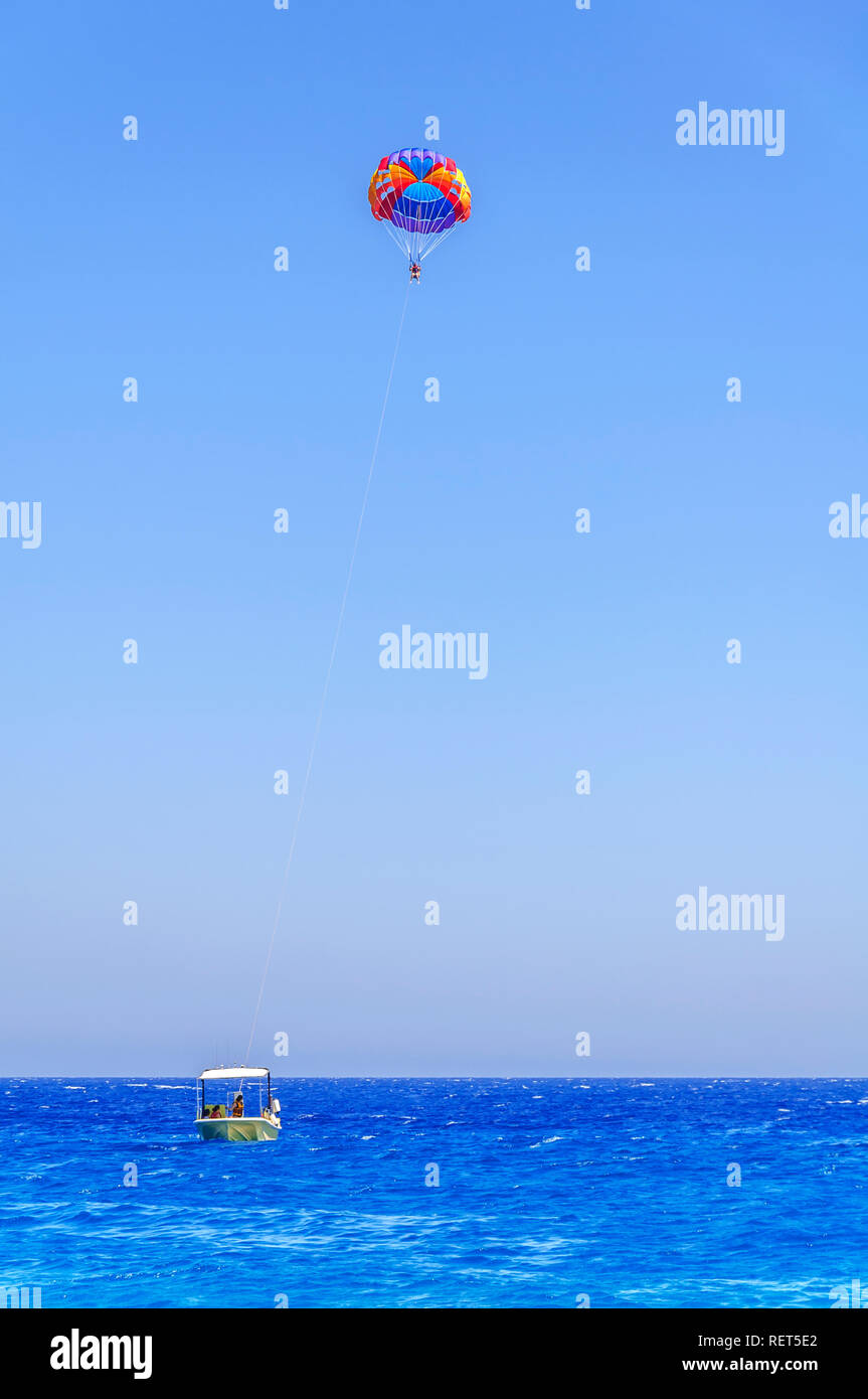 Skiing parachute skiing on blue wave sea and big clean sky Stock Photo