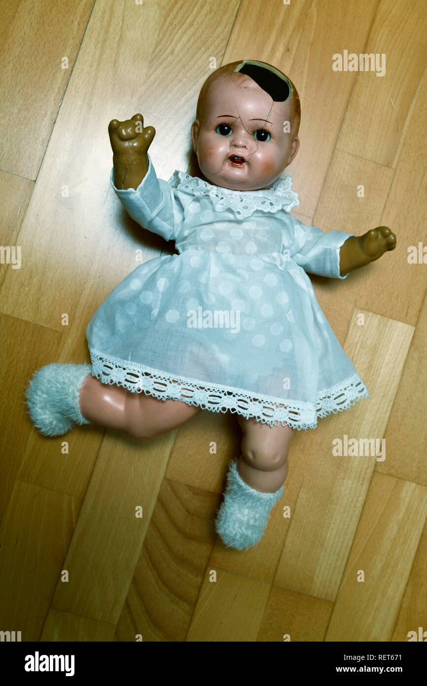 Symbol image child abuse, doll, damaged, lying on the ground, Baden-Württemberg, Germany Stock Photo