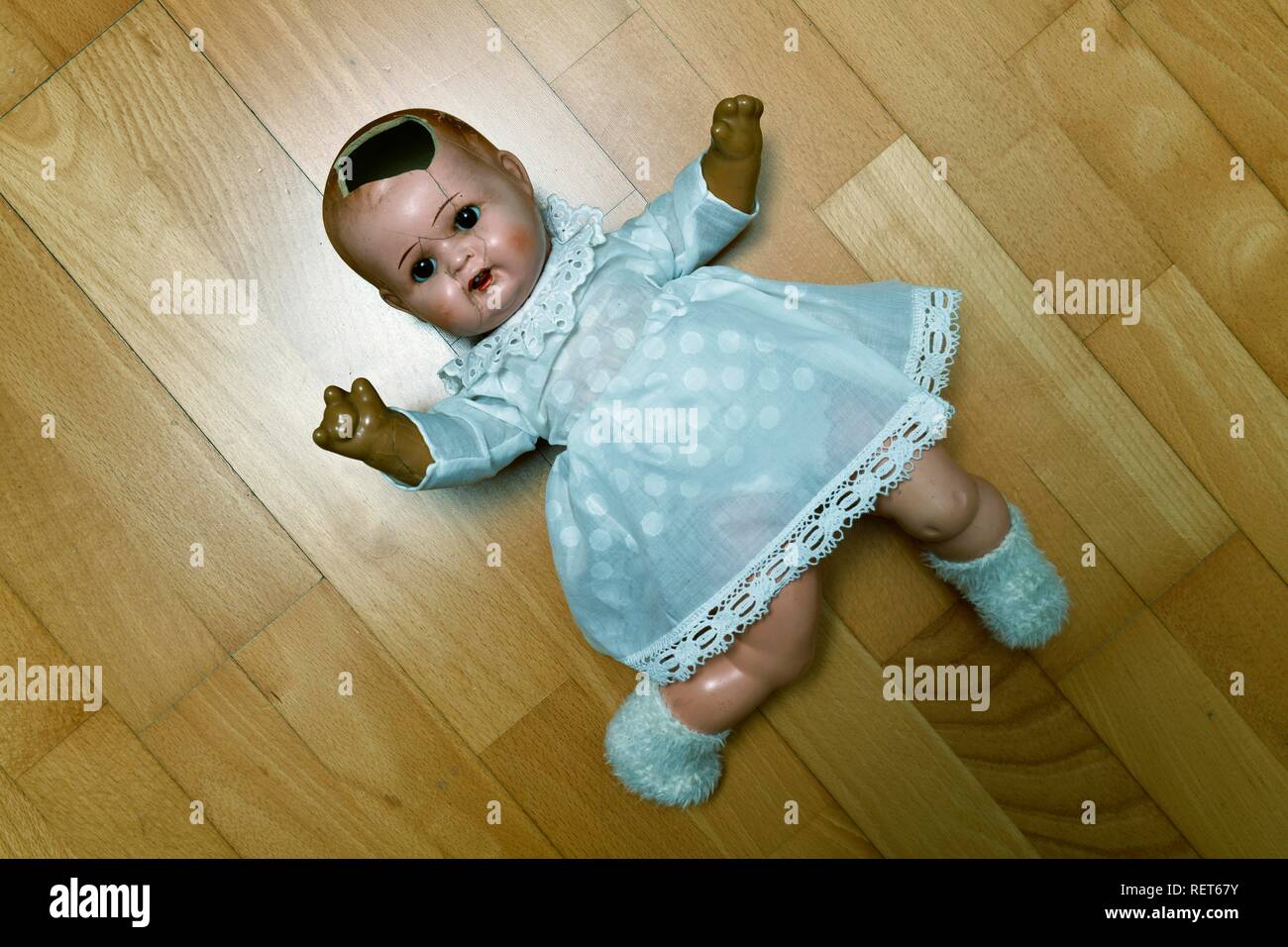Symbol image child abuse, doll, damaged, lying on the ground, Baden-Württemberg, Germany Stock Photo