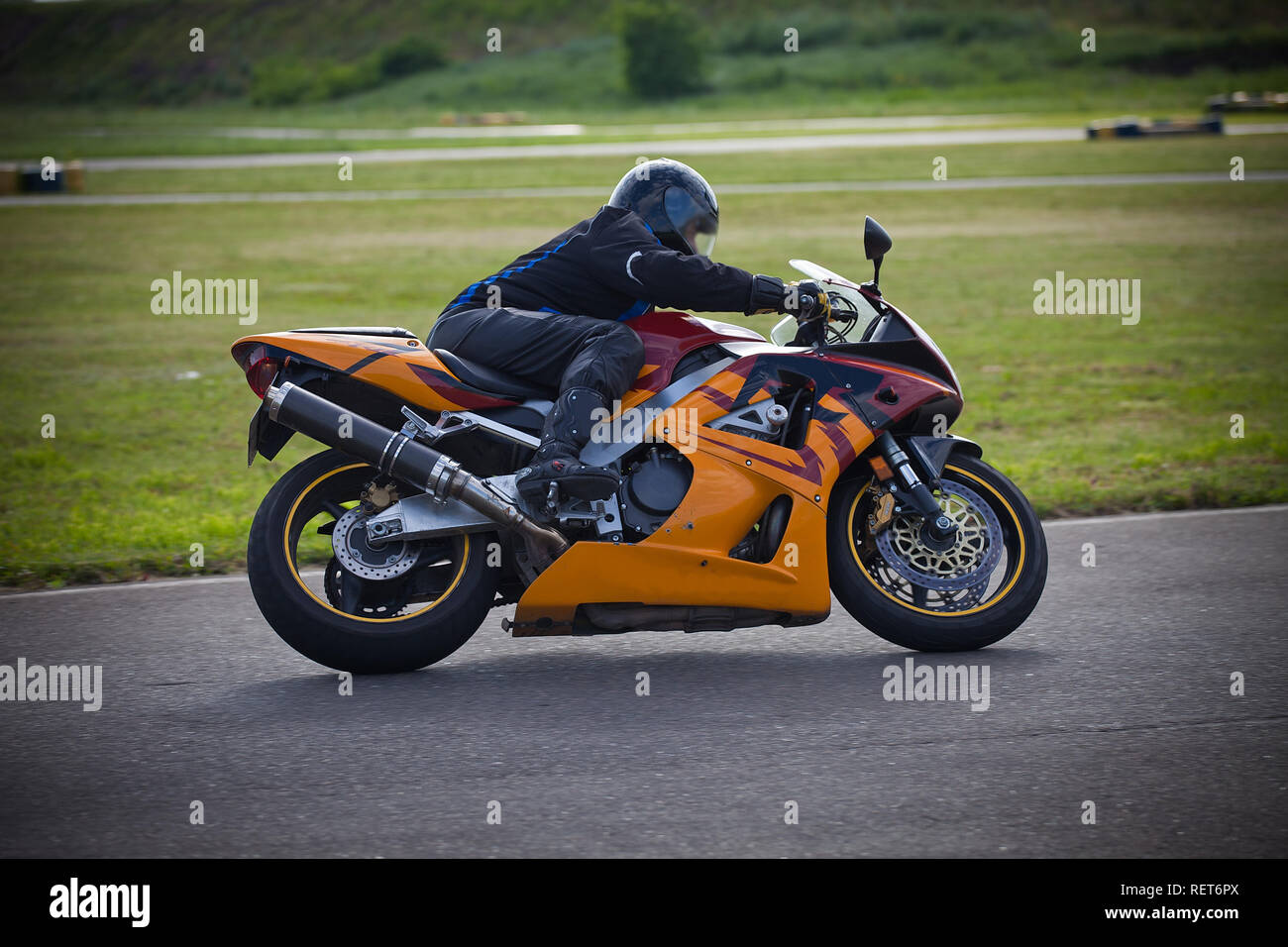 Moto-athlete begins to race on the racetrack. Motorcycle sport. FIM ...