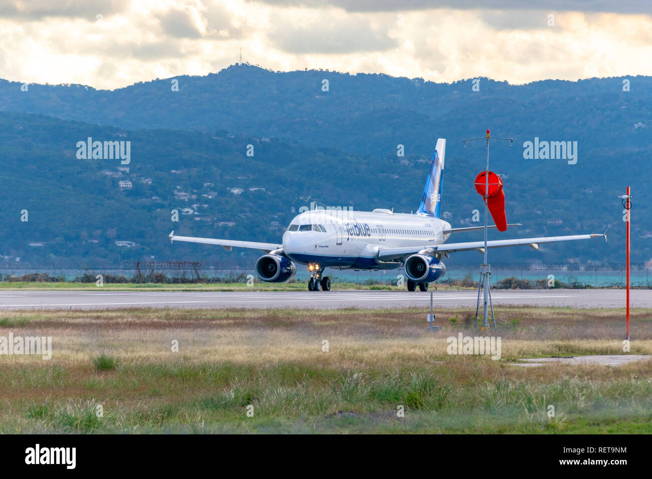 Montego Bay, Jamaica - January 21 2017: JetBlue aircraft arriving at the Sangster International Airport (MBJ) in Montego Bay, Jamaica. Stock Photo