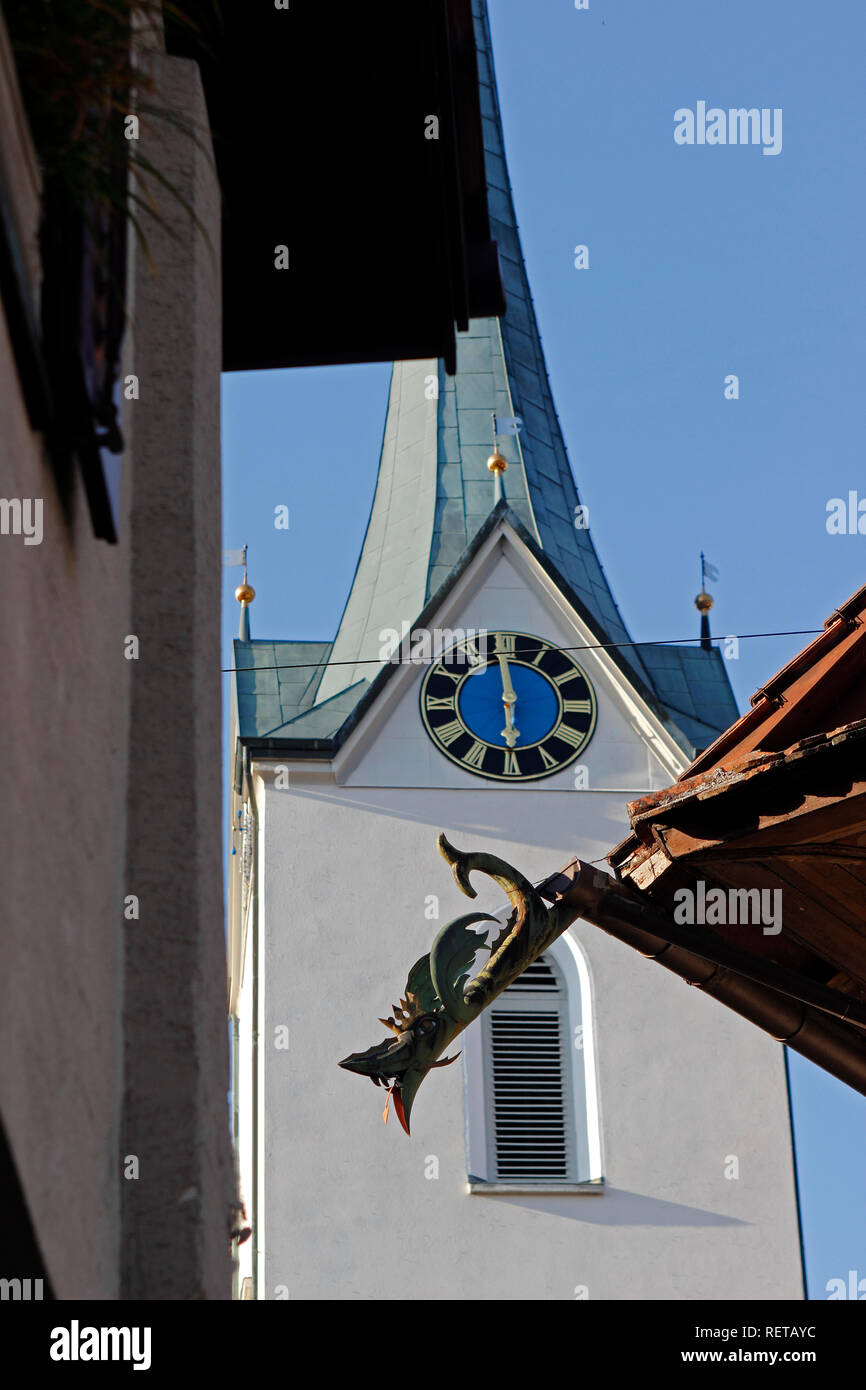 Switzerland Menzingen Canton Zug exterior Hotel Lowen decorative rainspout gargoyle church steeple with clock Stock Photo