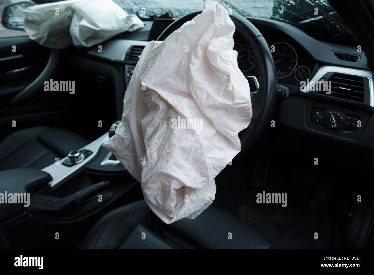 Car crash / vehicle damage; Deployed airbags and smashed windscreen