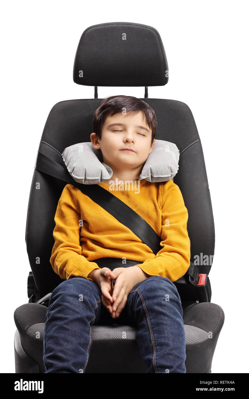 Young Boy Sleeping In A Car Seat With Neck Pillow Isolated On