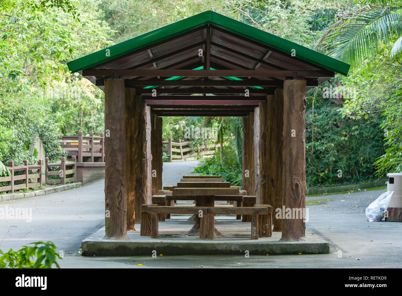 Gazebo with wooden benches and tables, Taipei Zoo, a.k.a. Muzha Zoo, zoological garden in Wenshan District, Taipei, Taiwan Stock Photo