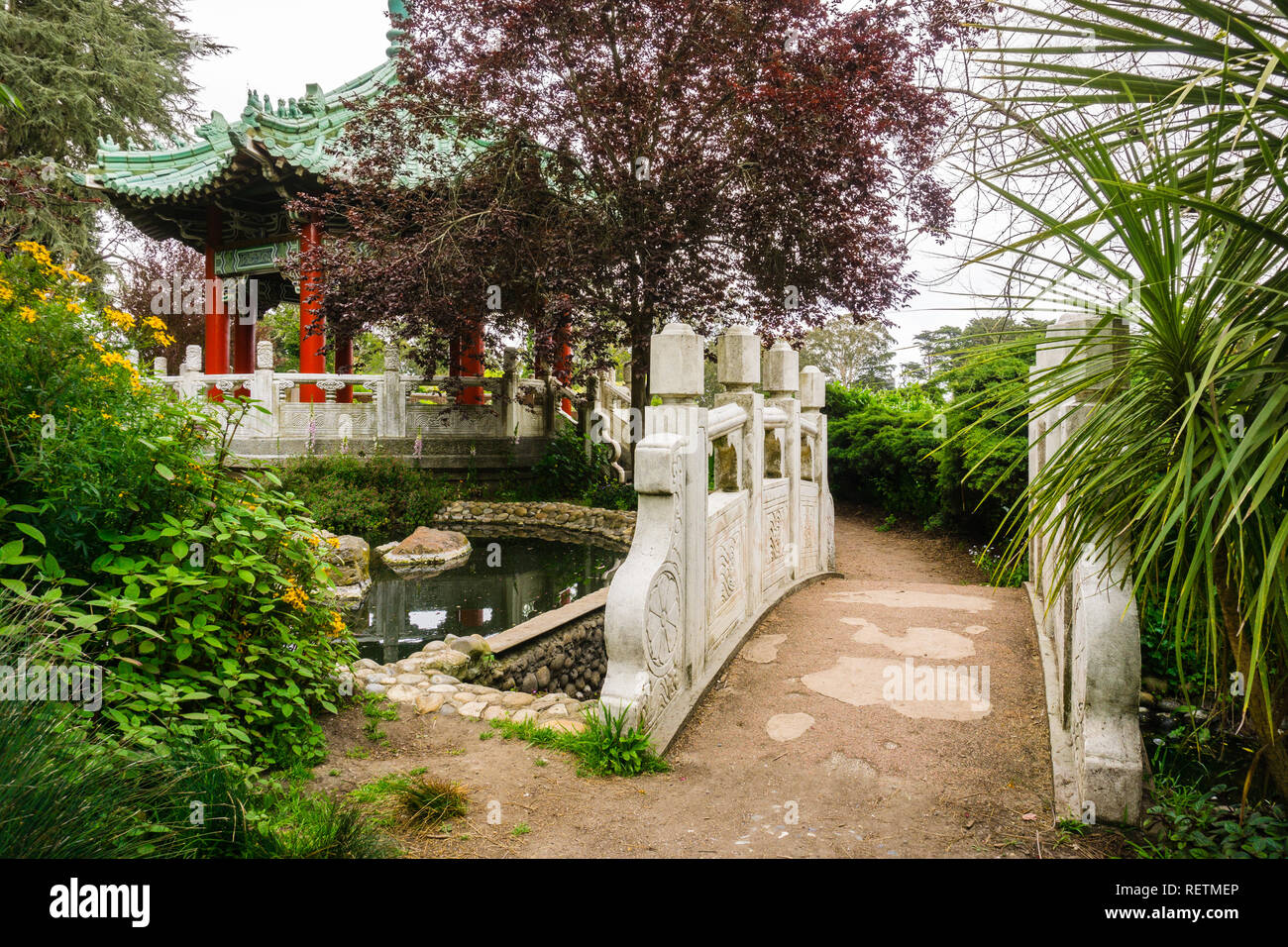 Paved trail going to the Chinese pavilion on the shoreline of Stow Lake