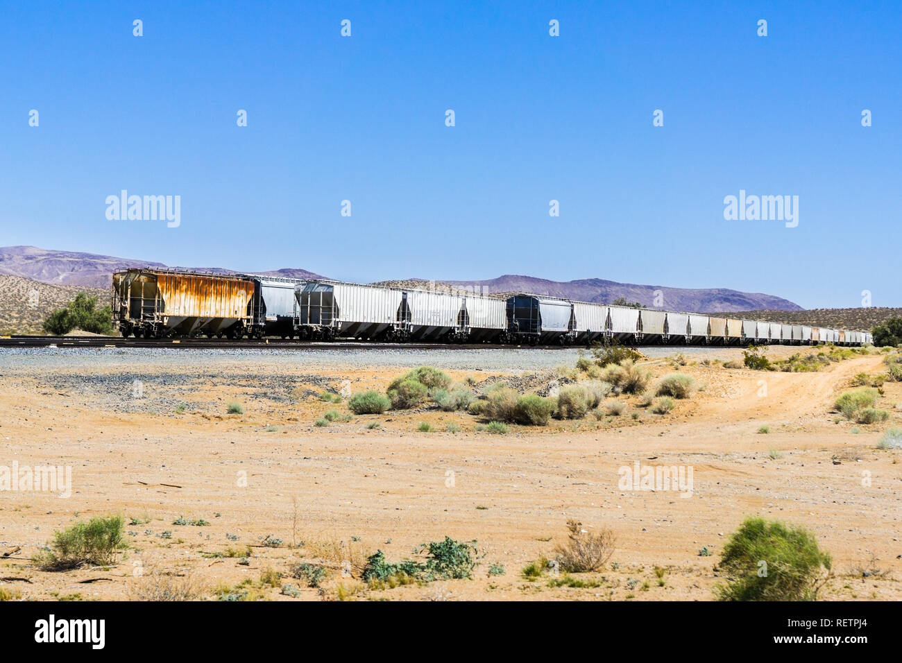 Freight train cars stopped on a desert area, Inyo County, California Stock Photo