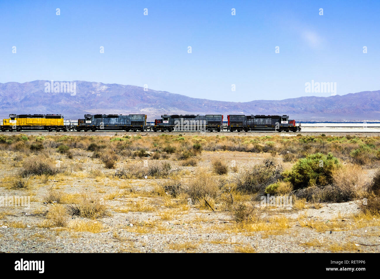 Train engines stopped on the tracks going through Searles Valley, Mojave Desert, California Stock Photo