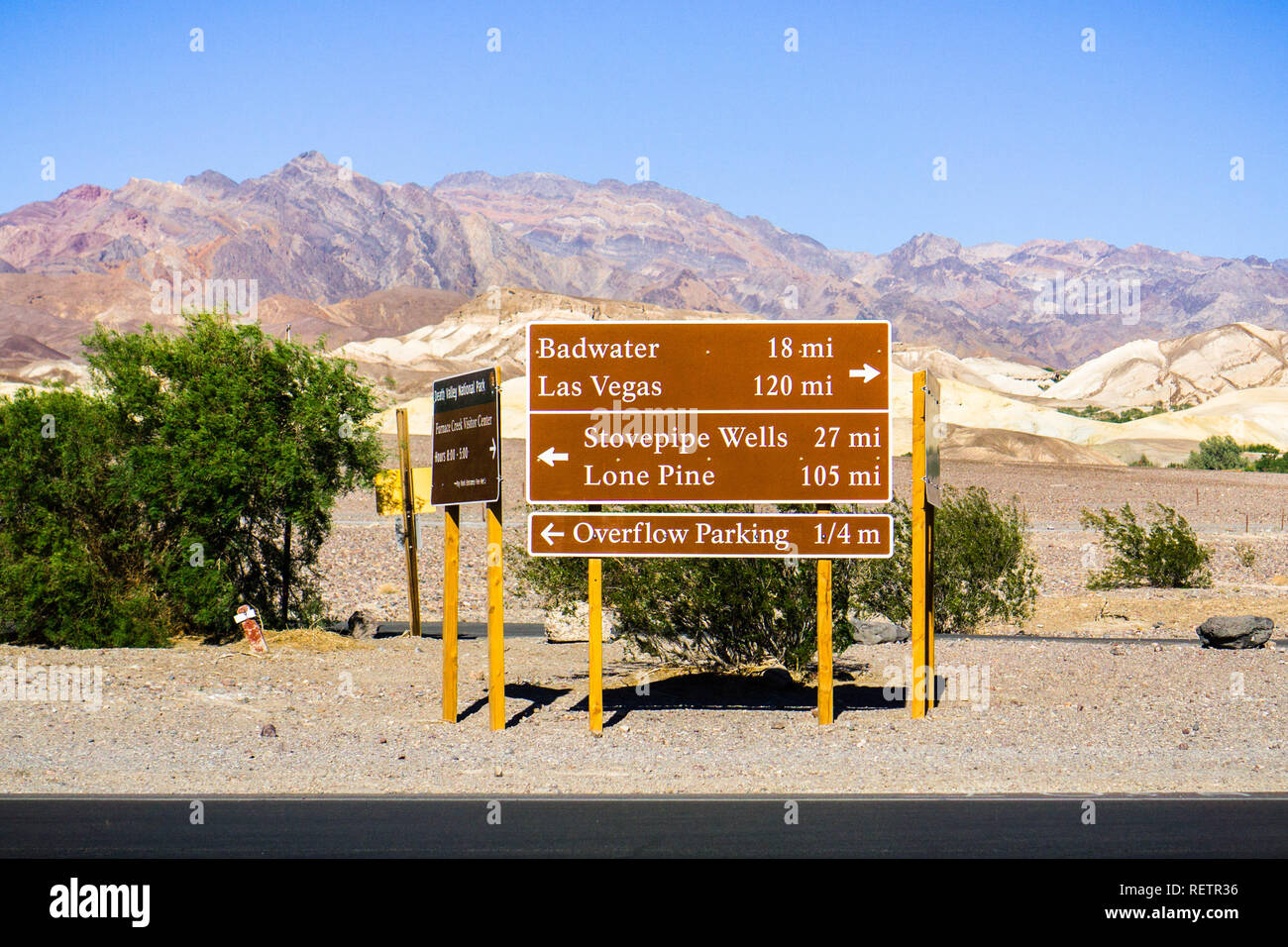 Posted road directions and distances close to the Furnace Creek Visitor Center; desert and