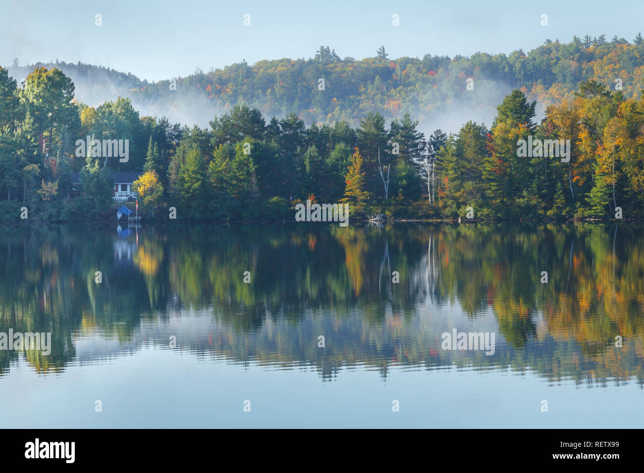 Early morning mist on a lake in Northern Ontario, Canada Stock Photo