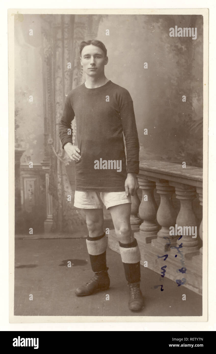 Original antique early 1900's studio portrait postcard of footballer, or rugby player, Northampton, U.K. circa , 1915 Stock Photo