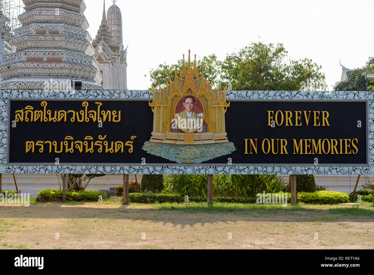 BANGKOK, THAILAND MARCH 15, 2017: Signboard that pays respect and condolences to King Bhumibol Adulyadej, the ninth monarch of Thailand from the Chakri dynasty as Rama IX, located at the Wat Arun temple in Yai district of Bangkok, Thailand Stock Photo