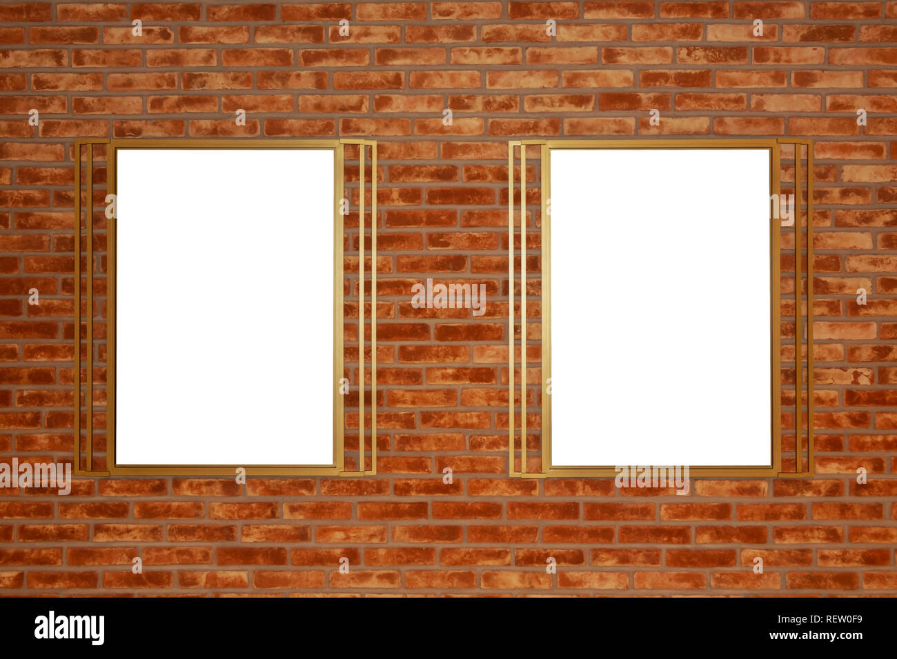 Two blank billboards attached to a buildings exterior brick wall. Stock Photo