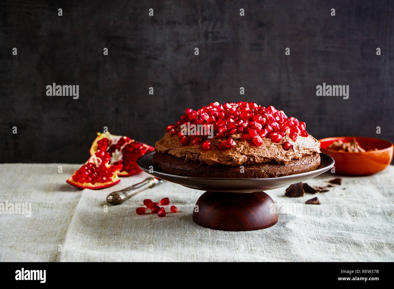 Chocolate cake with mascarpone cream and pomegranate Stock Photo