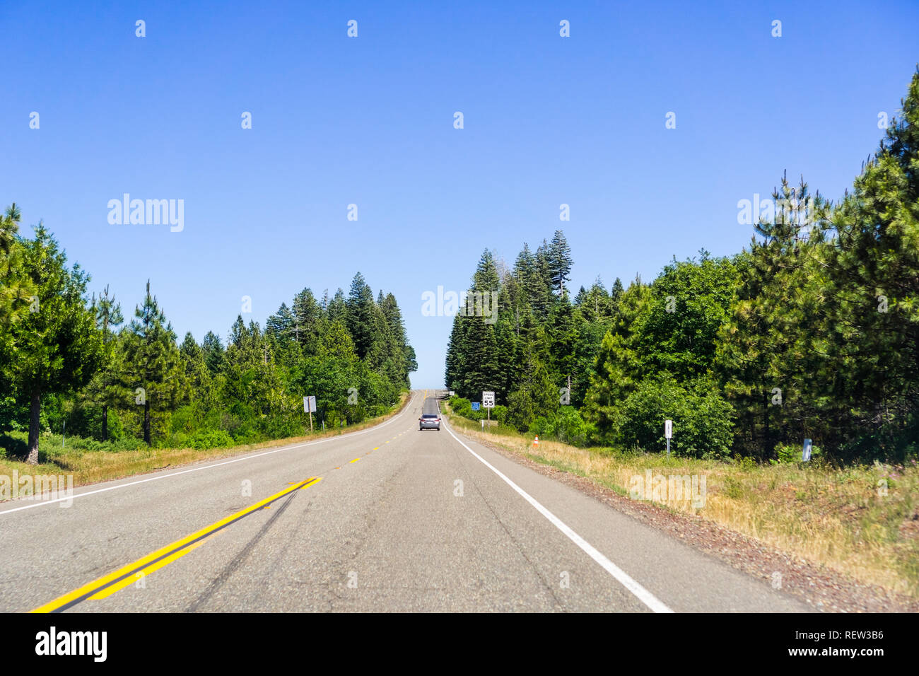 Driving on the highway between Redding and Burney on a sunny summer day, Shasta County, Northern California Stock Photo