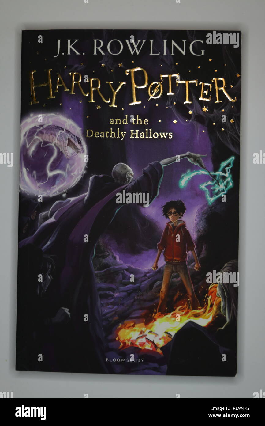 Harry Potter and the Deathly Hallows paperback on a white back ground Stock Photo
