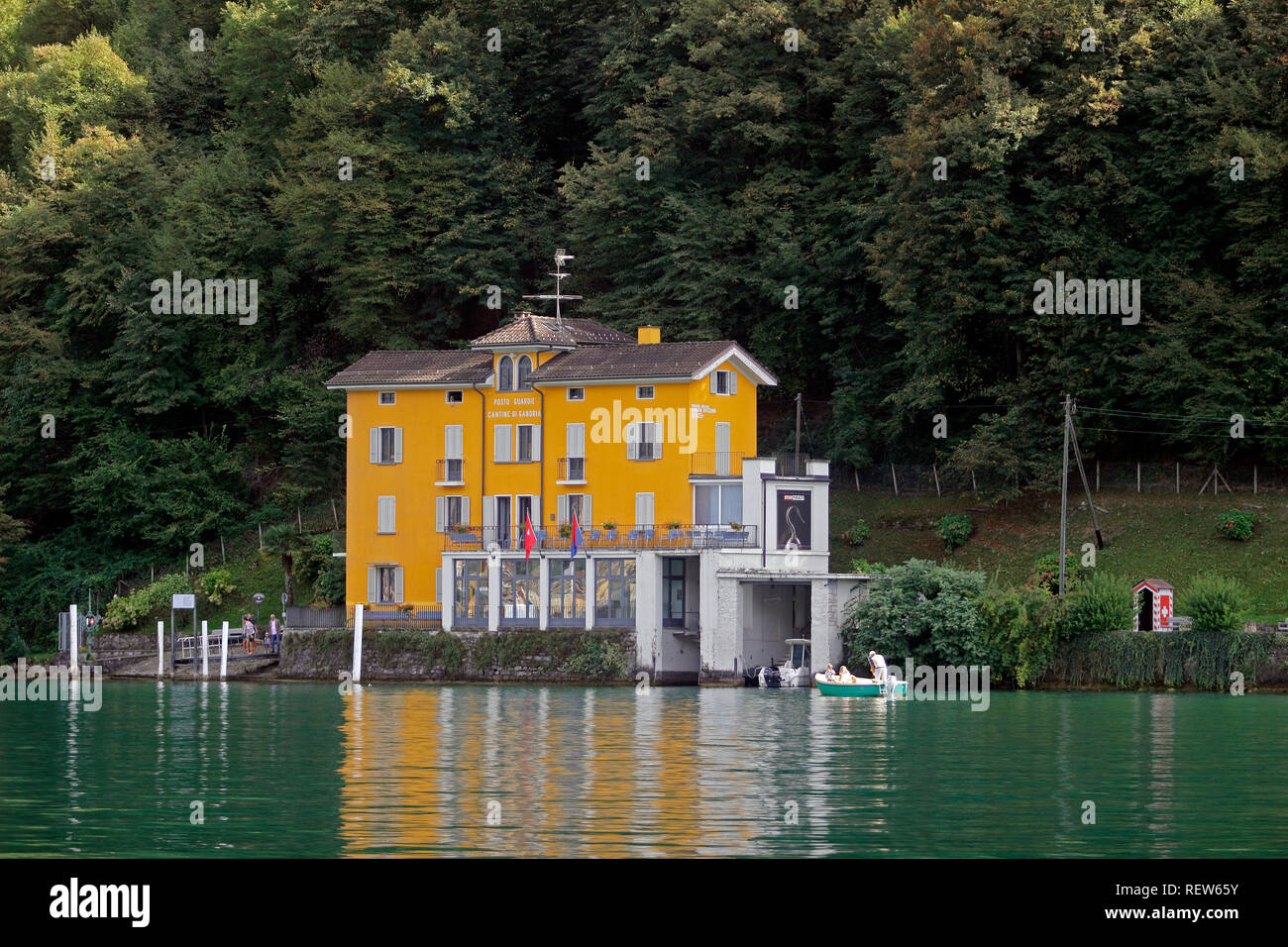 Switzerland Ticino Lugano Lake Lugano Swiss Alps lakeside Town of Gandria projects into lake lakeside old customs house cafe on lake Stock Photo