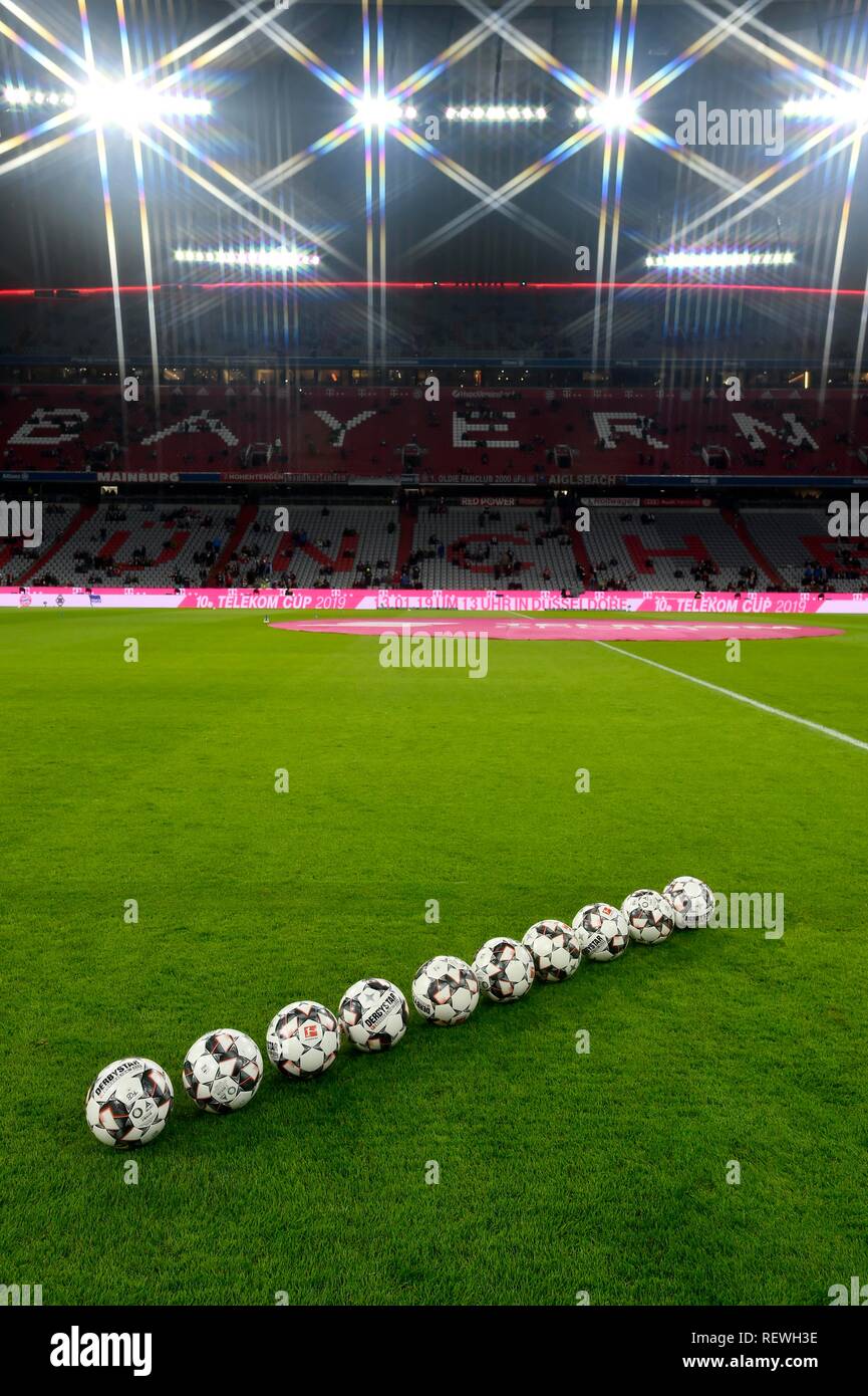 10 footballs adidas Derbystar in a row on grass, Allianz Arena, Munich, Bavaria, Germany Stock Photo