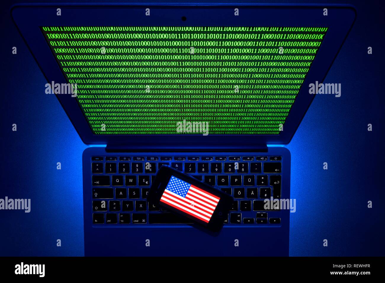 Smartphone with US flag on computer keyboard, symbol image Cybercrime, hacker attack, Baden-Württemberg, Germany Stock Photo