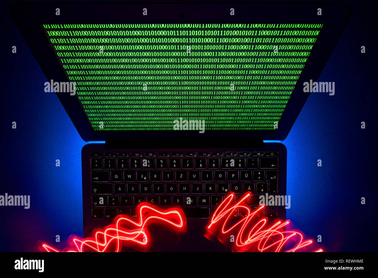Traces of light on computer keyboard, symbol image cybercrime, computer crime, data protection, Baden-Württemberg, Germany Stock Photo