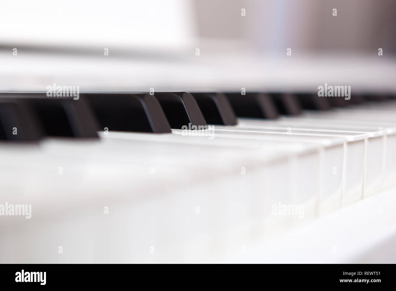 Close up of black and white piano keys. Shallow deep of field. Stock Photo