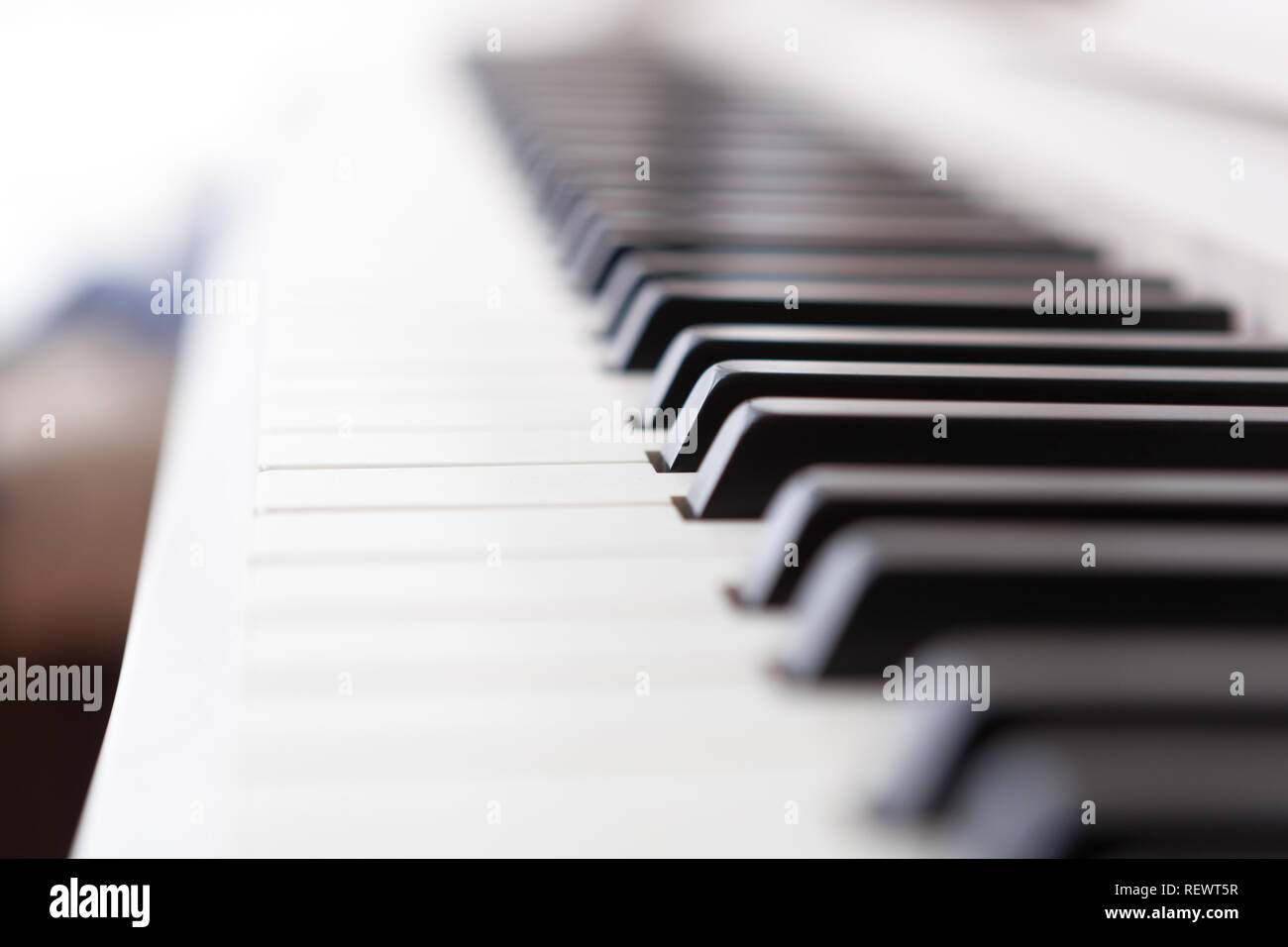 Close up of black and white piano keys. Shallow deep of field. Stock Photo