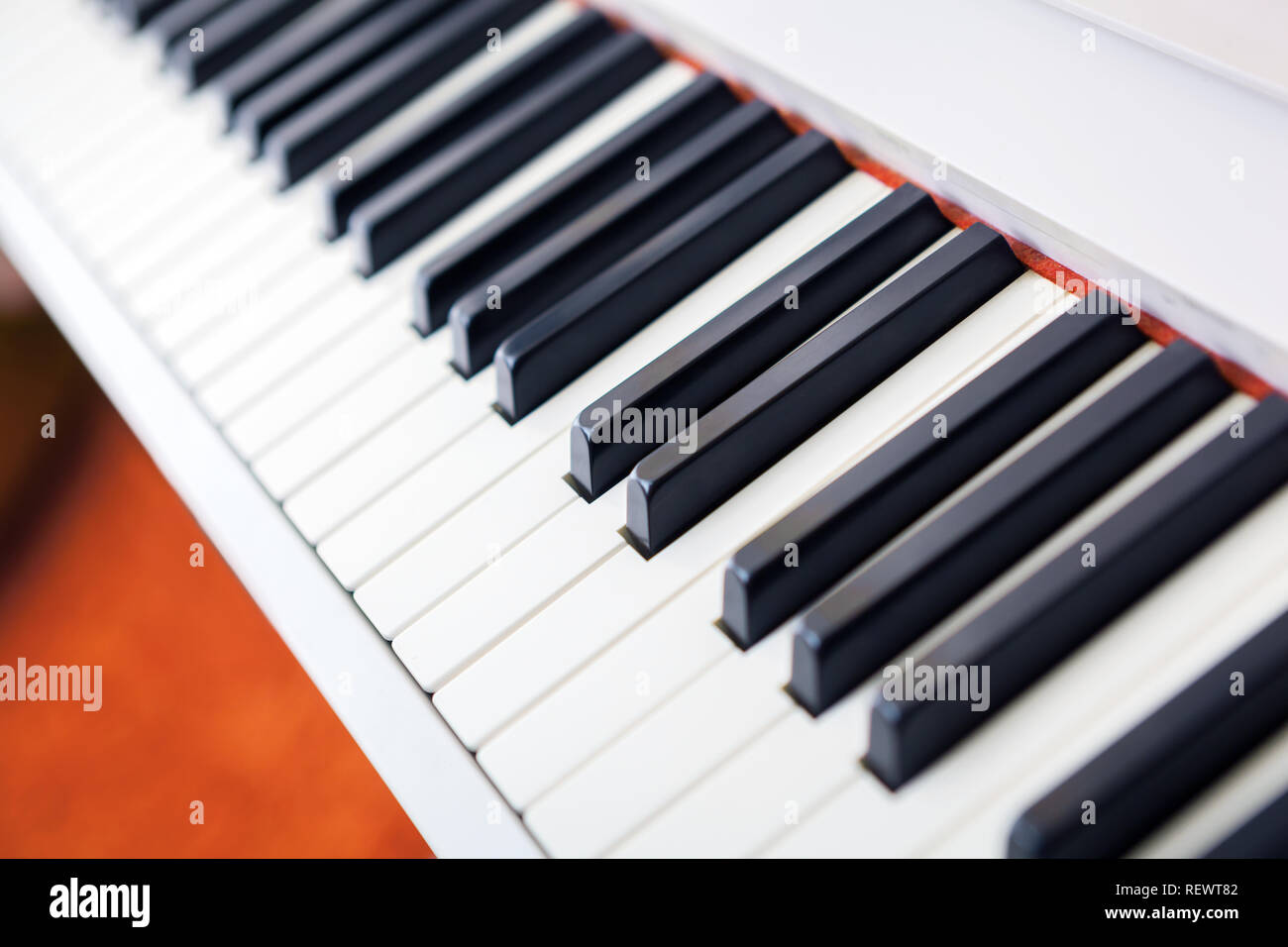 Close up of black and white piano keys. Shallow deep of field. Stock Photo