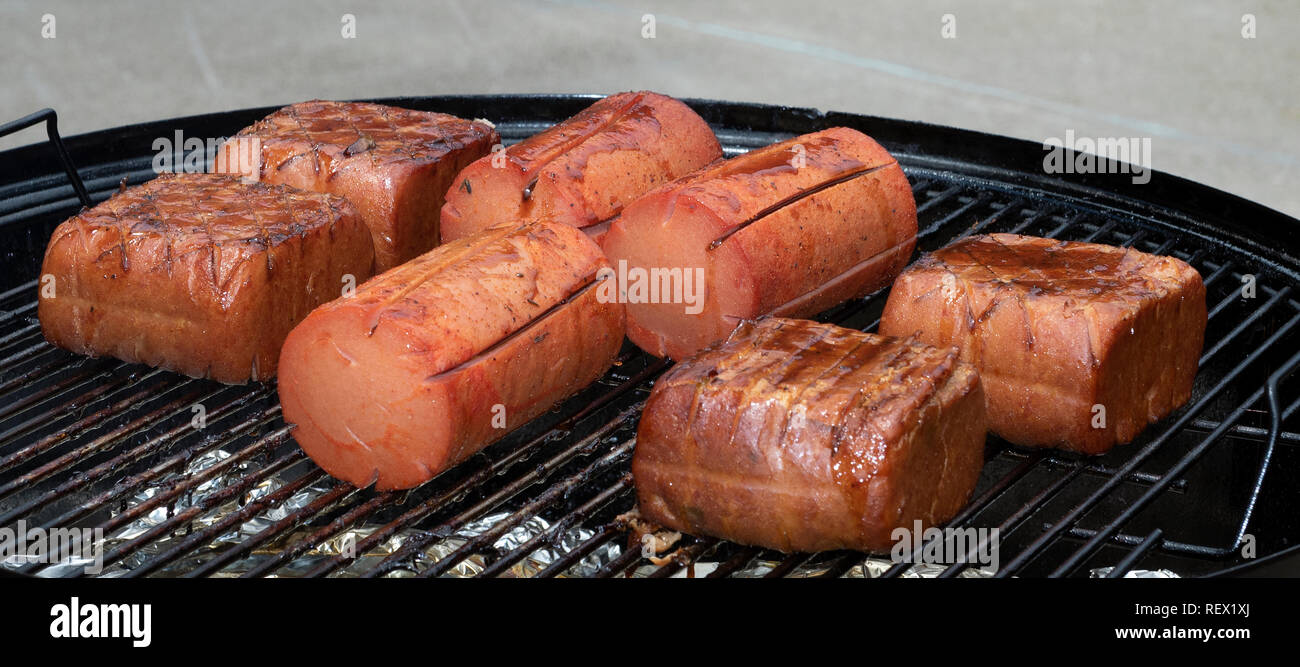 Smoking meat low and slow. Stock Photo