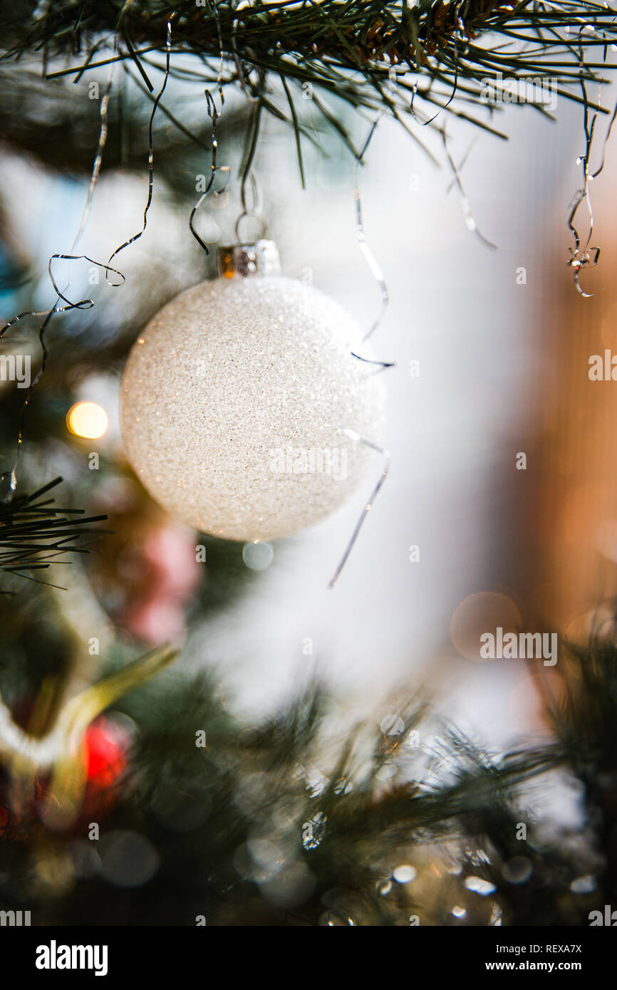 White Christmas Ornament on a Tree Stock Photo