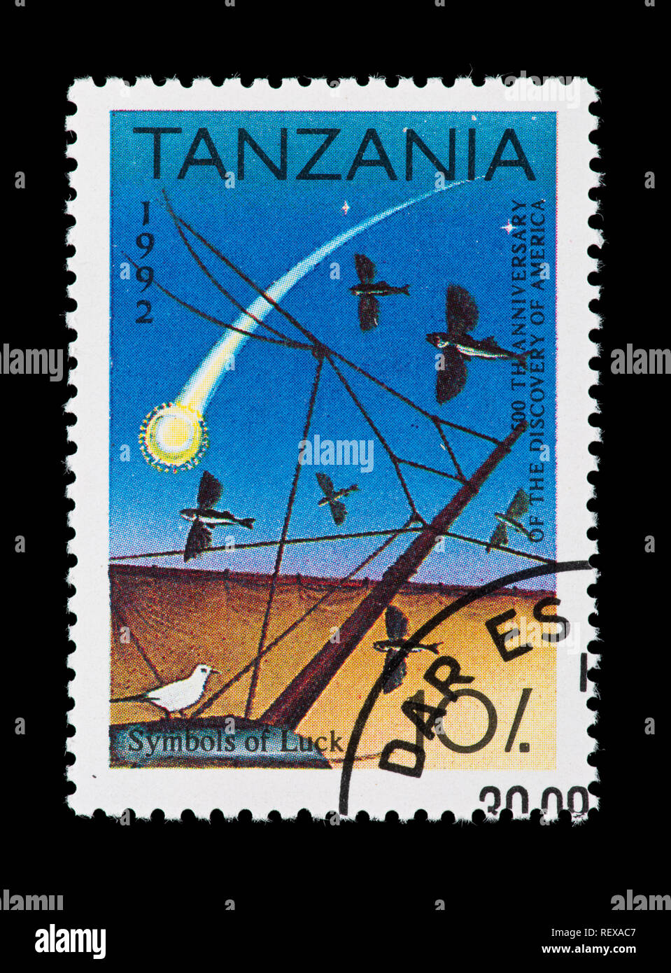 Postage stamp from Tanzania depicting various symbols of luck, issued for the 500th anniversary of the discovery of the Americas Stock Photo