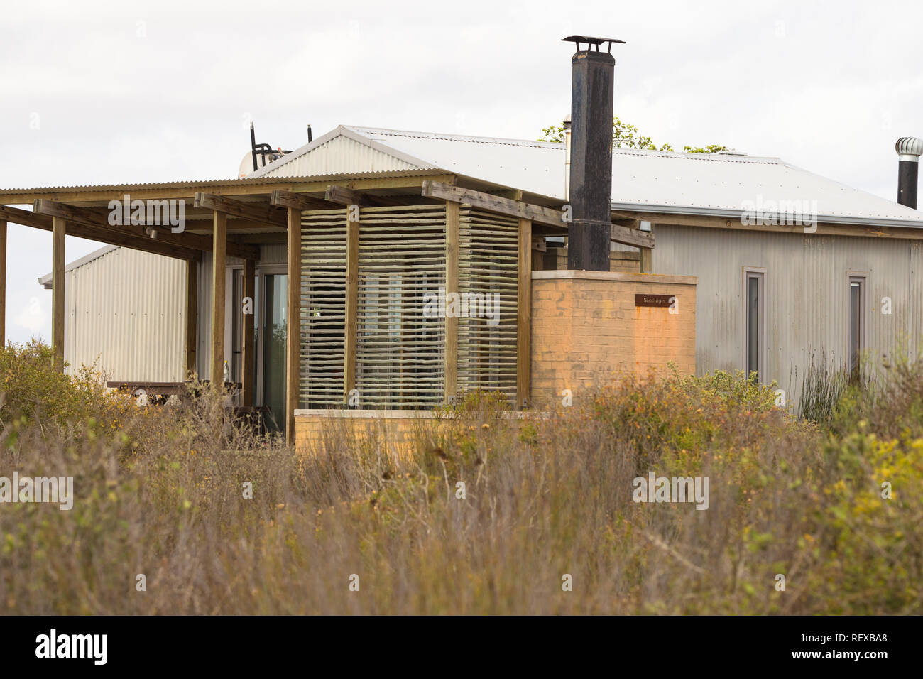 environmentally friendly cottage or cabin surrounded by Cape fynbos at Rocherpan nature reserve on the West Coast of South Africa Stock Photo