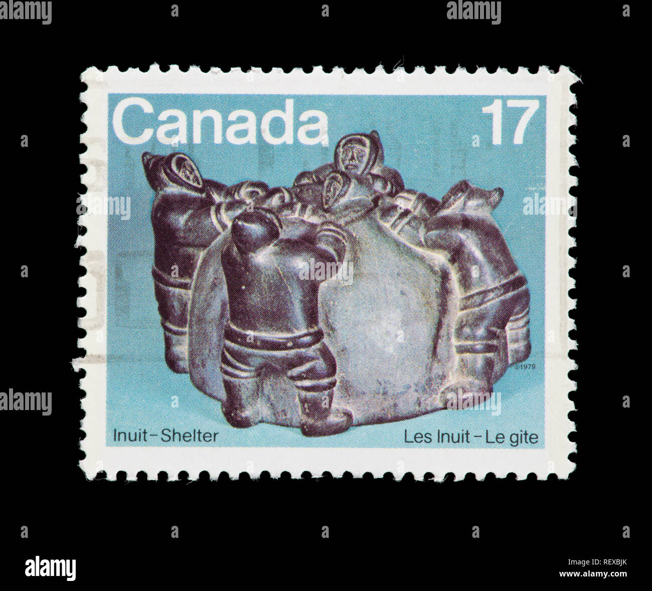 Postage stamp from Canada depicting the Abraham of Povungituk sculpture Eskimos building Igloo. Stock Photo